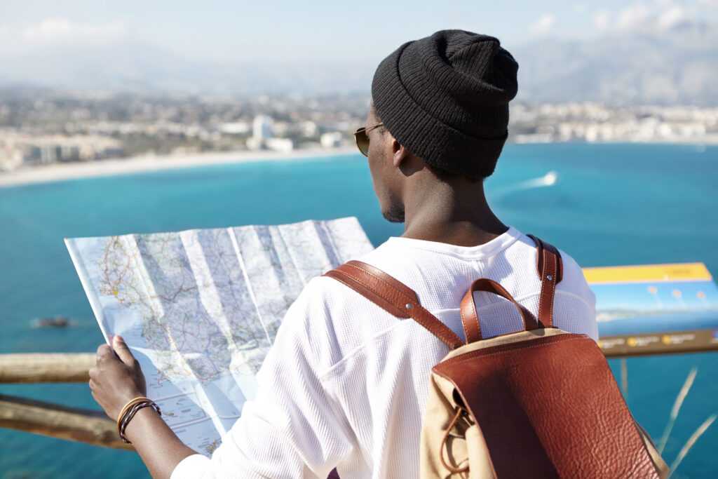 outdoor-back-shot-of-dark-skinned-tourist-with-lea-2026-03-17-03-06-08-utc