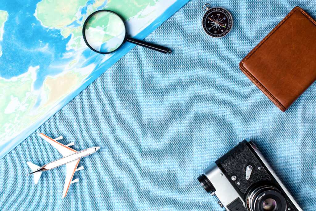 travel-accessories-on-blue-knitted-background-tra-2026-03-10-04-02-31-utc
