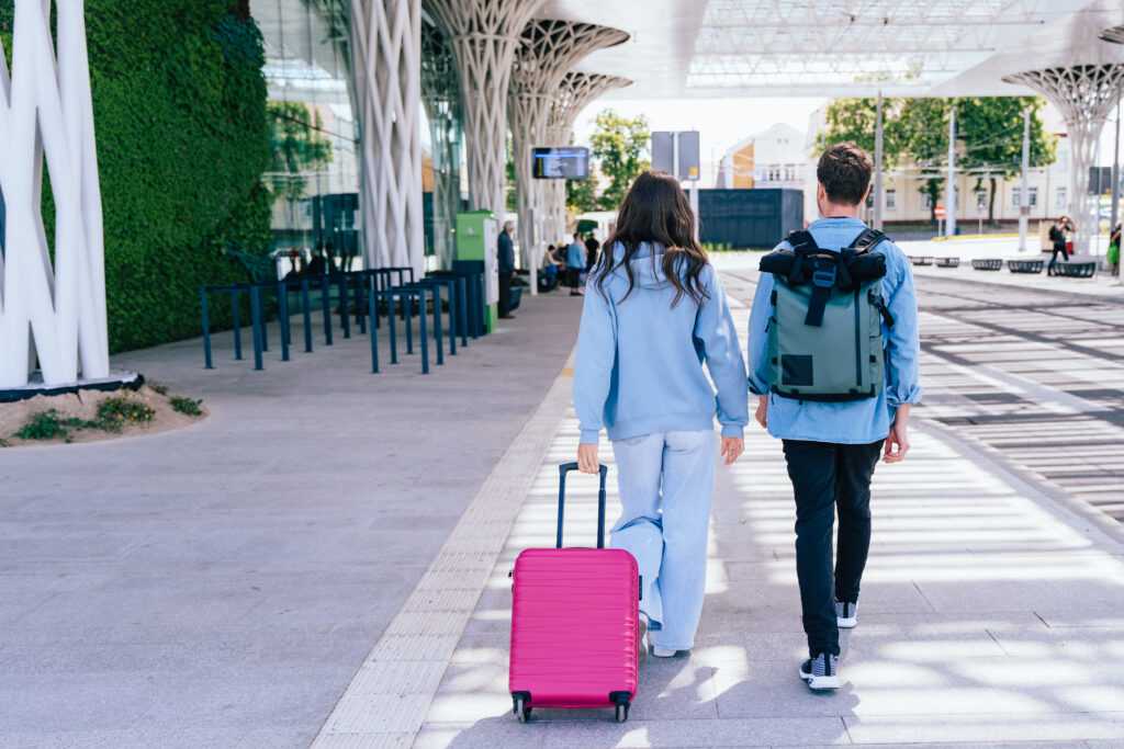 young-couple-traveling-with-luggage-at-modern-bus-2026-03-16-00-36-25-utc